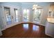 Cozy breakfast nook with large windows and access to the screened porch providing peaceful surroundings at 3711 Club Nw Dr, Kennesaw, GA 30144