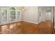 Elegant dining room with hardwood floors, chandelier, and natural light, perfect for Gathering gatherings at 3711 Club Nw Dr, Kennesaw, GA 30144