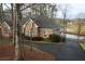 Elegant brick home with well-manicured landscaping, a private driveway, and scenic views of the golf course at 3711 Club Nw Dr, Kennesaw, GA 30144