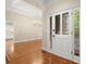 Bright foyer with hardwood floors, chandelier, and white front door with glass panels at 3711 Club Nw Dr, Kennesaw, GA 30144