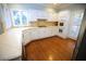 Well-maintained kitchen with white cabinets, tile countertops, and stainless steel appliances offering functionality at 3711 Club Nw Dr, Kennesaw, GA 30144