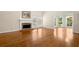 Spacious living room with hardwood floors, fireplace, and ample natural light creating a warm atmosphere at 3711 Club Nw Dr, Kennesaw, GA 30144