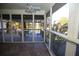 Inviting screened porch with tiled floor, fan, and views of the deck and backyard at 3711 Club Nw Dr, Kennesaw, GA 30144