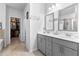 Double vanity bathroom with walk-in closet at 7417 Jennadee Dr, Fairburn, GA 30213