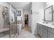 Bathroom with walk-in shower, bathtub, and vanity at 7417 Jennadee Dr, Fairburn, GA 30213