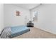 Small bedroom with twin bed and window at 7417 Jennadee Dr, Fairburn, GA 30213