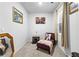 Cozy bedroom with chaise lounge and window at 7417 Jennadee Dr, Fairburn, GA 30213