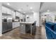 Modern kitchen with stainless steel appliances, granite countertops, and an island with seating at 7417 Jennadee Dr, Fairburn, GA 30213