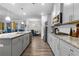 Bright, modern kitchen features granite countertops, gray cabinets, and stainless appliances at 7417 Jennadee Dr, Fairburn, GA 30213