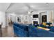 Spacious open-concept living room with fireplace and seamless flow to the dining area at 7417 Jennadee Dr, Fairburn, GA 30213