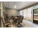 Relaxing screened porch with outdoor seating and grill at 7417 Jennadee Dr, Fairburn, GA 30213