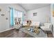 Cozy sitting area featuring a stylish sofa and gold accent pieces at 7417 Jennadee Dr, Fairburn, GA 30213