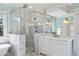 Bright bathroom with a marble shower, soaking tub, and modern vanity at 1581 Aragon Ne Way, Brookhaven, GA 30319