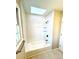 Bright bathroom featuring subway tiles, a skylight, and a shower at 2610 Woodridge Chase, Canton, GA 30114