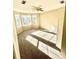 Bright bedroom featuring neutral-toned walls, plush carpet and large windows offering natural light at 2610 Woodridge Chase, Canton, GA 30114