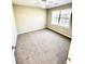 Bright bedroom featuring neutral-toned walls, plush carpet, and large windows offering natural light at 2610 Woodridge Chase, Canton, GA 30114