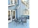 Cozy outdoor deck features metal table and chairs, perfect for relaxing and dining at 2610 Woodridge Chase, Canton, GA 30114