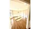 Bright dining room featuring hardwood floors, wainscoting, and modern chandelier lighting at 2610 Woodridge Chase, Canton, GA 30114