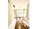 Light and bright entryway featuring hardwood floors, decorative door and stairs with white railings at 2610 Woodridge Chase, Canton, GA 30114
