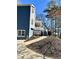 Side view of house with steps up to covered porch at 2610 Woodridge Chase, Canton, GA 30114