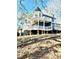 Elegant two-story home with a wrap-around porch and a second story deck for outdoor enjoyment at 2610 Woodridge Chase, Canton, GA 30114