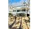 Charming two-story home with an inviting wrap-around porch, perfect for relaxing outdoors at 2610 Woodridge Chase, Canton, GA 30114