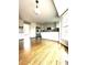 Kitchen with hardwood floors and modern stainless steel appliances and white cabinets at 2610 Woodridge Chase, Canton, GA 30114