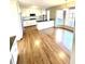 Spacious kitchen with hardwood floors, modern appliances, and large center island with counter seating at 2610 Woodridge Chase, Canton, GA 30114