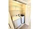 Convenient laundry room equipped with washer, dryer, and wire shelving for storage at 2610 Woodridge Chase, Canton, GA 30114