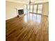 Living room with hardwood floors, a cozy fireplace, and an abundance of natural light at 2610 Woodridge Chase, Canton, GA 30114