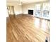 Living room featuring hardwood floors, a fireplace, and a ceiling fan at 2610 Woodridge Chase, Canton, GA 30114