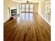 Open living room with hardwood floors, a fireplace, and lots of windows for plenty of natural light at 2610 Woodridge Chase, Canton, GA 30114