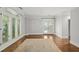 Well-lit bedroom with hardwood floors, french doors, and large windows at 2960 S Pharr Nw Ct # N2, Atlanta, GA 30305