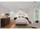 Bright bedroom with hardwood floors, a plush bed, and plenty of natural light at 2960 S Pharr Nw Ct # N2, Atlanta, GA 30305