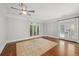 Spacious bedroom with hardwood floors, french doors, and a large area rug at 2960 S Pharr Nw Ct # N2, Atlanta, GA 30305