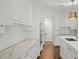White kitchen cabinets and marble countertops at 2960 S Pharr Nw Ct # N2, Atlanta, GA 30305