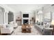 Living room with fireplace, large windows, and neutral decor at 2960 S Pharr Nw Ct # N2, Atlanta, GA 30305