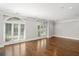 Large living room with hardwood floors and shuttered windows at 2960 S Pharr Nw Ct # N2, Atlanta, GA 30305