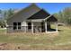 Backyard with brick and siding exterior and green grass at 3019 Fairway Dr, Villa Rica, GA 30180