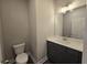 Bathroom featuring a granite countertop, modern fixtures, and tile flooring at 3019 Fairway Dr, Villa Rica, GA 30180