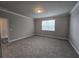 The bedroom has neutral walls, white trim and carpeted flooring at 3019 Fairway Dr, Villa Rica, GA 30180