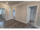Bedroom with hardwood flooring and multiple doorways at 3019 Fairway Dr, Villa Rica, GA 30180