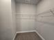 A small walk-in closet with installed shelving at 3019 Fairway Dr, Villa Rica, GA 30180