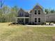 Two-story brick home with landscaped lawn and large windows at 3019 Fairway Dr, Villa Rica, GA 30180
