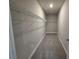 A walk-in closet featuring built-in shelving and carpeted floors at 3019 Fairway Dr, Villa Rica, GA 30180
