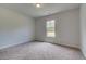 Simple bedroom with neutral walls and carpeting at 26 Homesite Cooper E Cv, Fayetteville, GA 30214