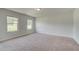 Spacious bedroom with neutral carpeting and large windows at 26 Homesite Cooper E Cv, Fayetteville, GA 30214
