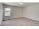 Bright bedroom featuring neutral walls and carpet at 26 Homesite Cooper E Cv, Fayetteville, GA 30214