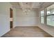 Formal dining room with hardwood floors, wainscoting, and a chandelier at 26 Homesite Cooper E Cv, Fayetteville, GA 30214