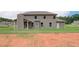 Two-story house with backyard patio and large grassy area at 26 Homesite Cooper E Cv, Fayetteville, GA 30214